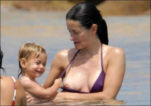 carrie mink add courteney cox nip slip image